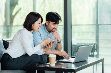 Young Asian business man and woman