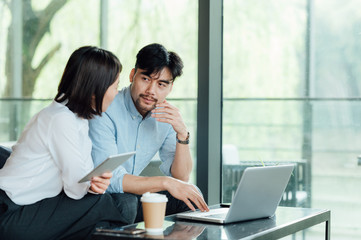 Young Asian business man and woman