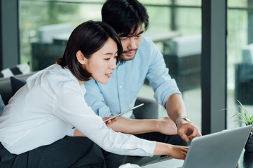Young Asian business man and woman
