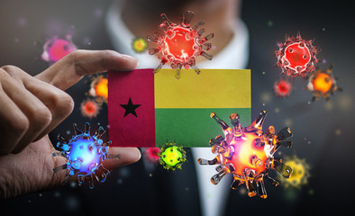 Corona Virus Around Guinea-Bissau Flag. Concept Pandemic Outbreak in Country