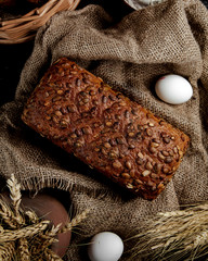 black bread topped with seeds