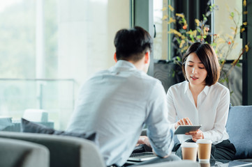 Young Asian business man and woman