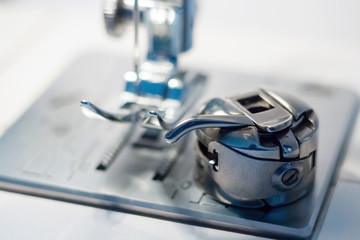 Sewing machine. Seamstress. Sewing machine Shuttle. Clothing manufacture.