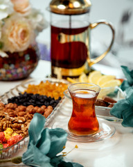black tea in armudu glass and sweets