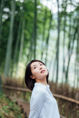 Young Asian women in bamboo forest