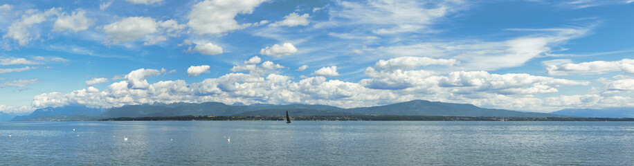 panorama with a black yacht on the Geneva lake