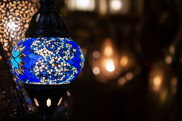 Colorful blue Moroccan lamp with blue glass mosaic design. Oriental style.