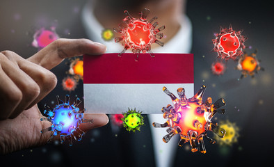 Corona Virus Around Indonesia Flag. Concept Pandemic Outbreak in Country