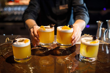 barman make a cocktail in a restaurant