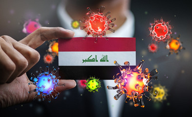 Corona Virus Around Iraq Flag. Concept Pandemic Outbreak in Country