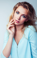 Fototapeta premium young pretty stylish blond hipster girl posing emotional isolated on white background happy smiling cool smile, lifestyle people concept