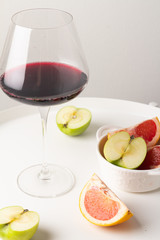 glass of red wine and grapes