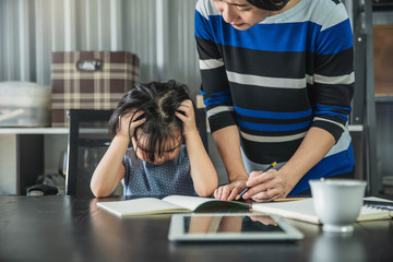 Children and learning concept. Child student concentrate in lesson. Kid hard at work in home...