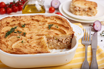 Potato casserole. Mashed potato baked with ground meat of pork and chicken and cheese, decorated with thyme
