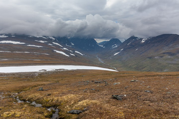 View of the valley. Northern Sweden, Sarek National Park in stormy weather. selective focus