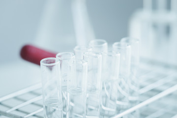 Serum liquid bottle to test tube, laboratory research and development concept. scientist sample chemistry or medicine test. Sampling of covid-19 infectious idea.