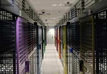 Room with rows of server hardware in data center