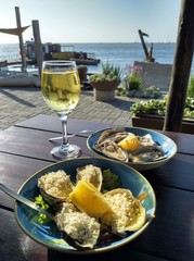 Fresh oysters with a glass of white wine in Walvis Bay on the Atlantic Coast in Namibia