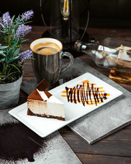 cheesecake topped with cofee and cup of coffee