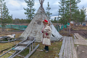 female saami, sami in national dress, saami village on the Kola Peninsula, Russia.