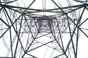 High angle view of high voltage electricity tower in sunny day with clear sky background