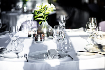 Beautiful table set for an event party or wedding reception . restaurant interior	