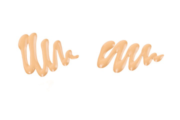 Obraz premium Liquid foundation swatch isolated on white background. Close Up of makeup cream sample.