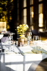 Beautiful table set for an event party or wedding reception . restaurant interior	