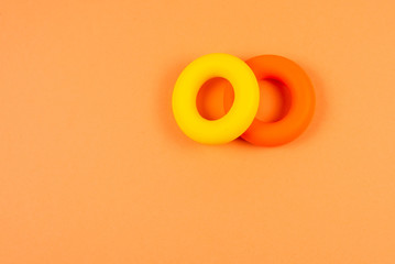 Yellow and orange expander on orange  background.