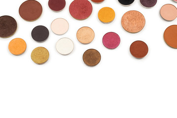 Round multicolored make up eyeshadows isolated on white.
