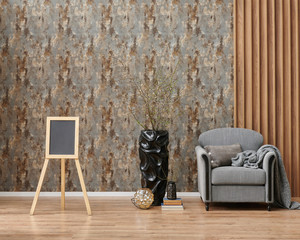 Grey wallpaper background with brown luxury decor, armchair, black vase of plant.