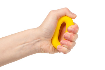 Yellow and orange expander in woman hand isolated on white background.