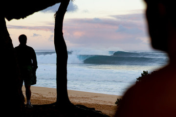 a guy watching waves at Pipeline Hawaii