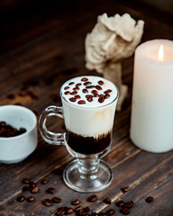 coffee cocktail with whipped cream and coffee beans on top