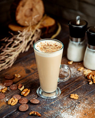 coffee drink topped with crushed cookie and walnuts