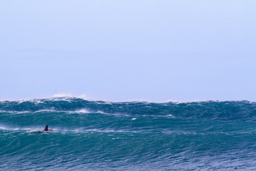 Surfer waiting for huge wave