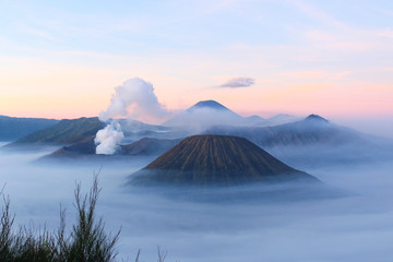 Panoramic view of Mount Bromo covered by morning fog at sunrise, East Java, Indonesia.