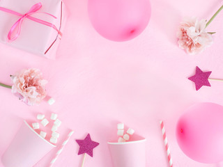 Birthday decorations with balloons, gift boxes, flowers, paper cups.