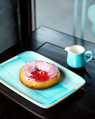 donut with pink cream topping