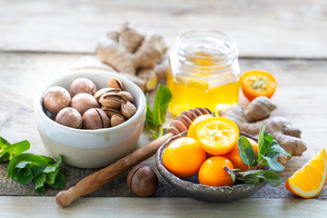 set of products to boost the immune system. Honey, lemon, nuts, ginger to Immunity boosting.