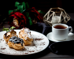 eclairs with a cup of tea