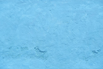 Blue wall with embossed surface. Blue abstract background.