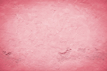 Red background with vignette effect. Pastel red wall with embossed surface. 