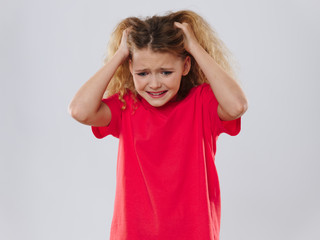 portrait of a little girl with a headache