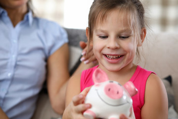 Girl holding money box