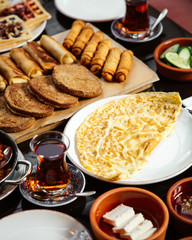 fried eggs with bakery and black tea