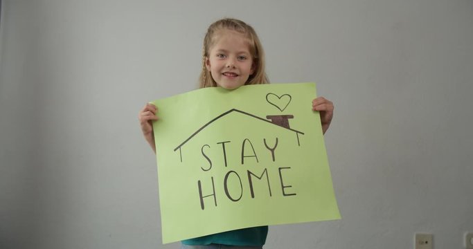 coronavirus quarantined girl holds a sign stay home save lives