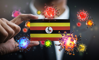 Corona Virus Around Uganda Flag. Concept Pandemic Outbreak in Country