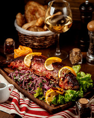 fried fish with sliced onion and lemon