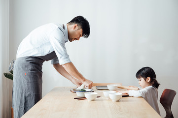 Father and daughter at home dumplings